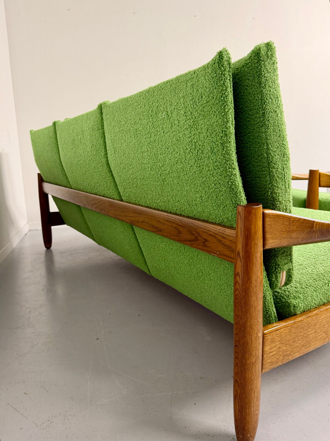Living room sofa and Scandinavian design armchairs from the 1960s in green boucle.