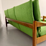 Living room sofa and Scandinavian design armchairs from the 1960s in green boucle.