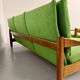 Living room sofa and Scandinavian design armchairs from the 1960s in green boucle.