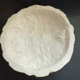 Bas relief sun in plaster