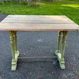 Old table with patinated green legs