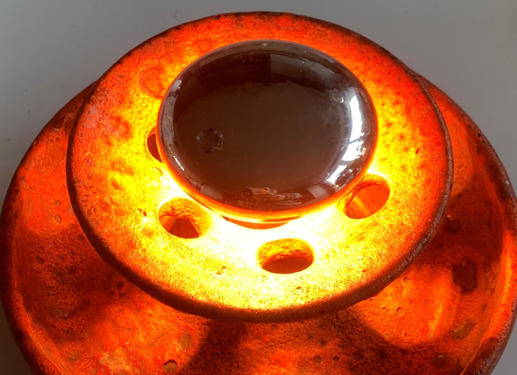 Ambient spot in orange glazed terracotta from the 1960s