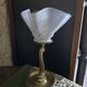 Table lamp with brass fish and draped glass tulip.