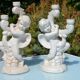 Pair of "cherub" candle holders in plaster