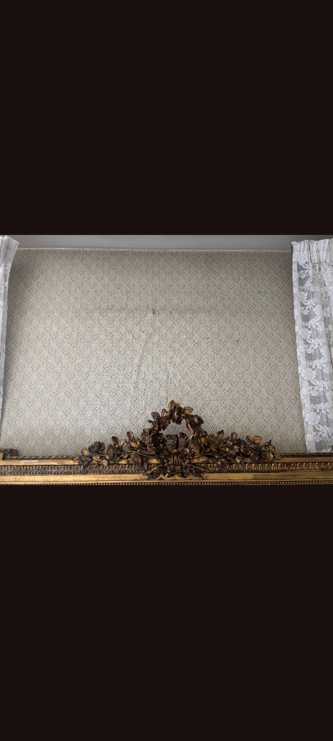 Large mirror from the Napoleonic III era with a floral pediment.