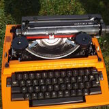 Electric writing machine adler orange and black with its suitcase