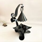 Handcrafted black wrought iron candle holder with its vintage extinguisher