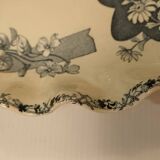 Old earthenware dish on foot