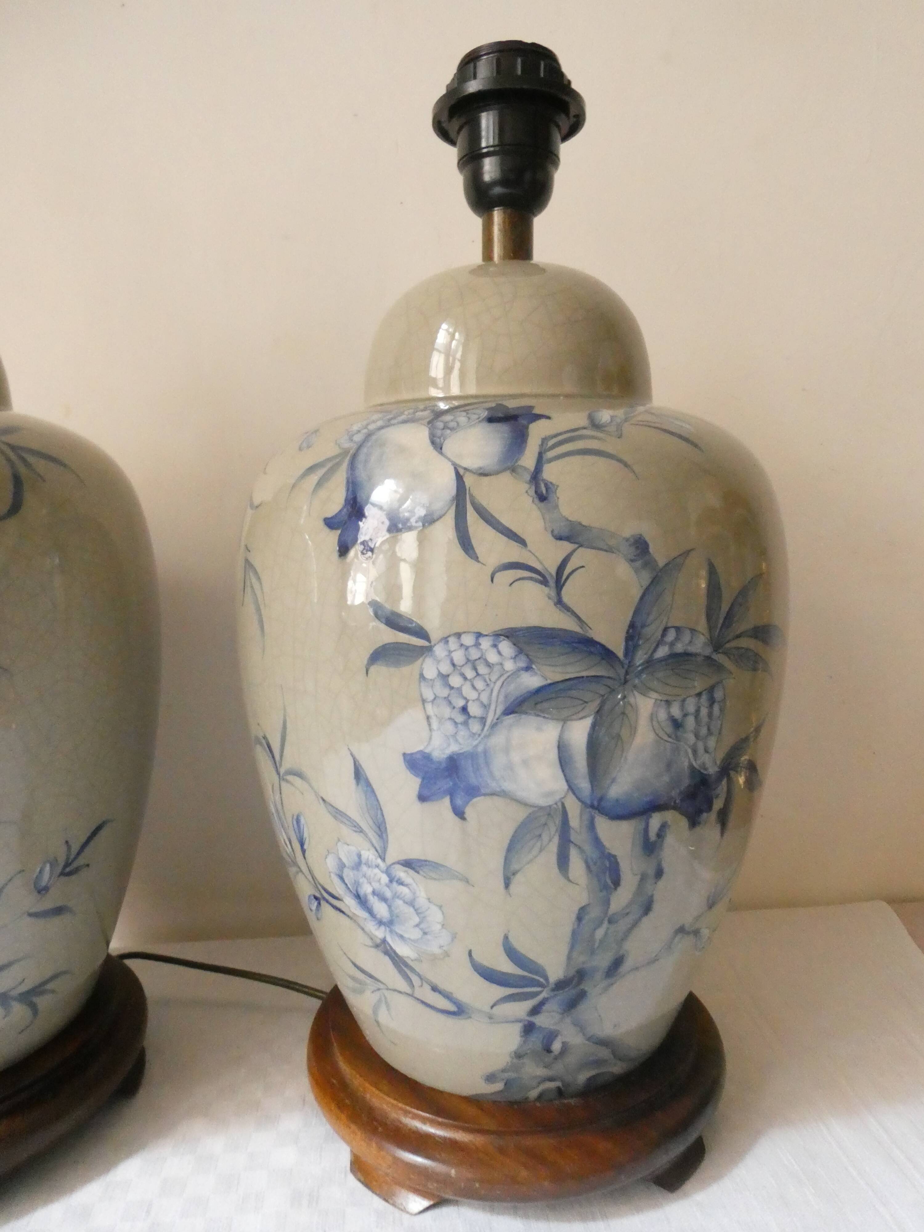 Pair of celadon crackle ceramic lamp bases decorated with flowers.