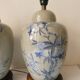Pair of celadon crackle ceramic lamp bases decorated with flowers.