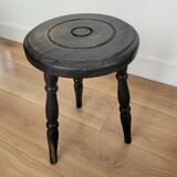 Black wooden tripod stool