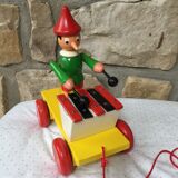 Old toy to pull Pinocchio and his xylophone