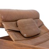 Lounge chair and ottoman, in blond elm and leather. 1970s