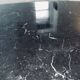 Table basse pied tulipe en marbre noir