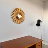 Old large golden sun mirror with rounded witch's eye in vintage resin from the 70s