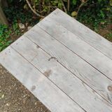 Antique bistro table with iron legs and wooden top