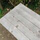 Antique bistro table with iron legs and wooden top