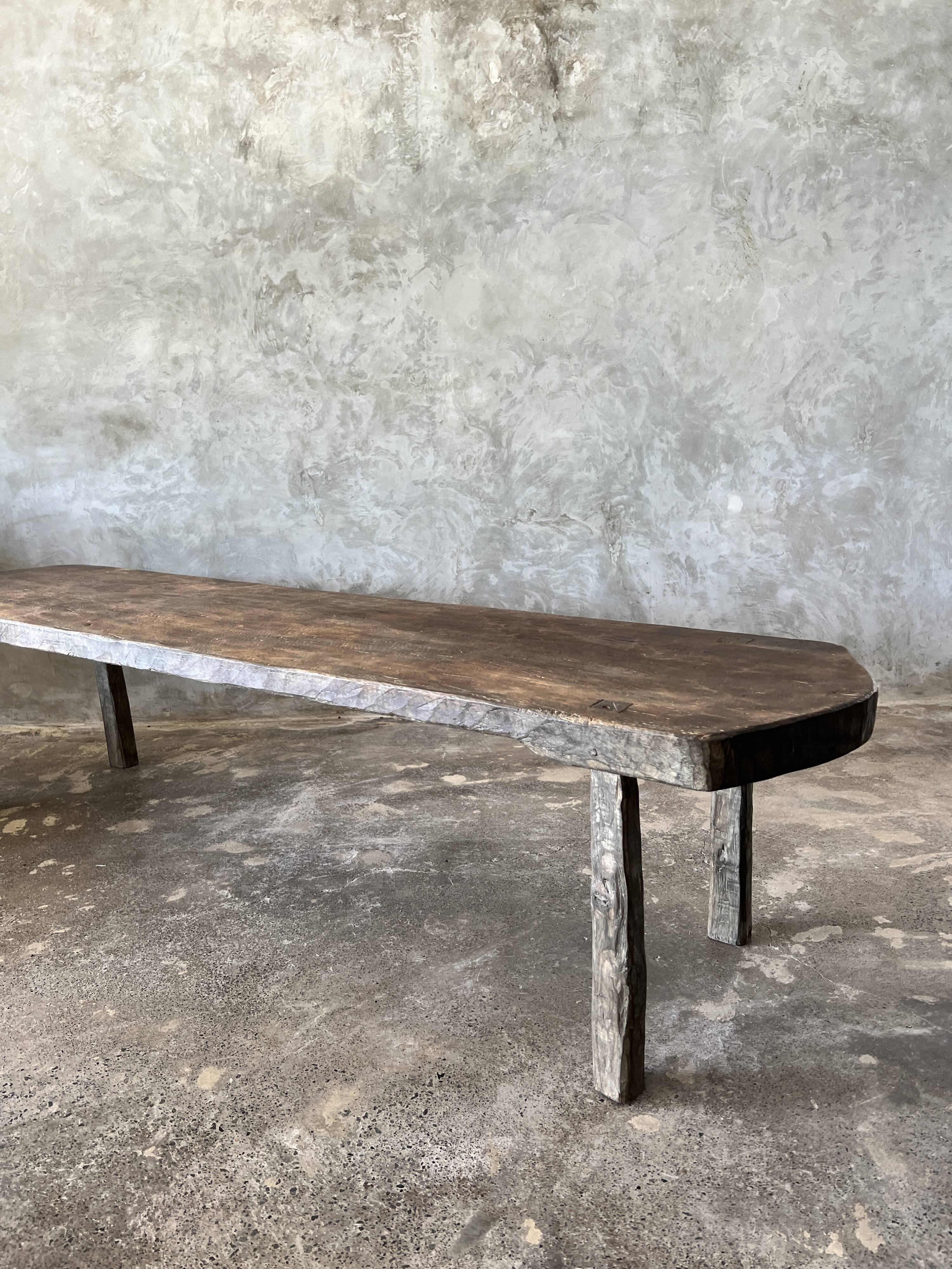 Large rounded coffee table in old Asian teak
