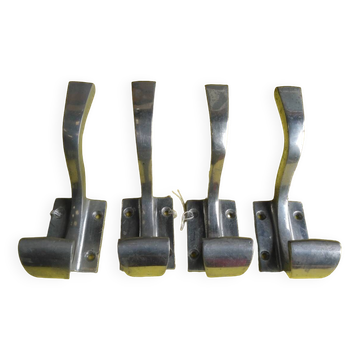 Set of four aluminium coat hooks from the 1950s.
