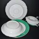 Paris porcelain set of 3 plates and a sauce boat with green border and gold monogram JC.