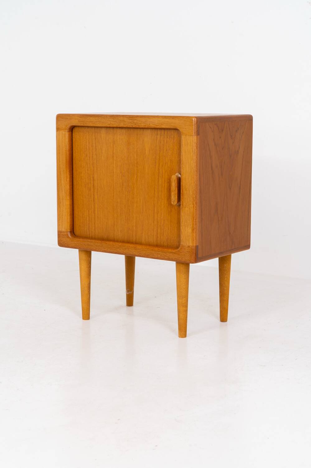 Compact cabinet with tambour door by CFC Silkeborg (Denmark, 1960s).