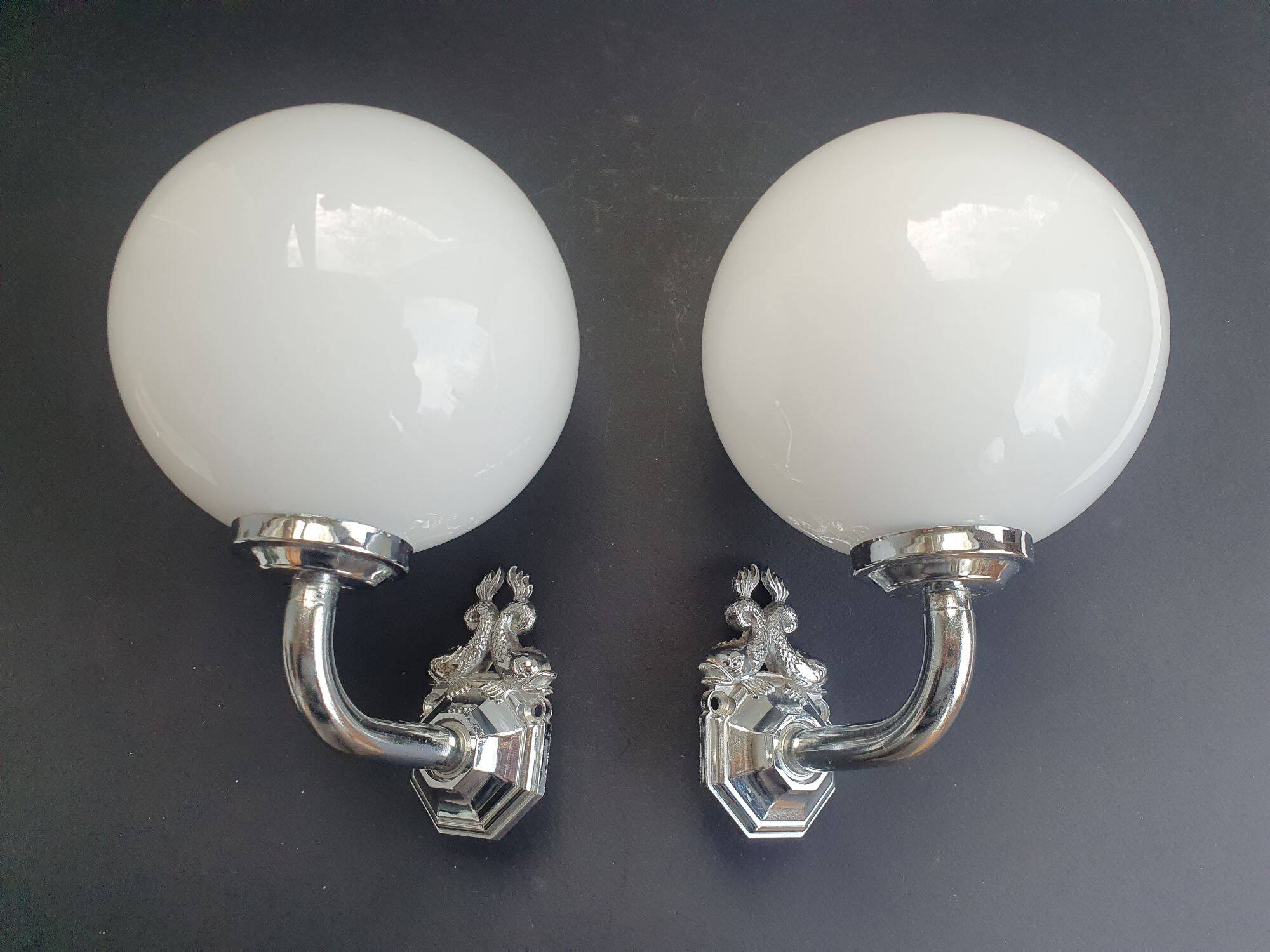 Pair of chrome wall sconces for bathroom with vintage fish pattern.