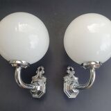 Pair of chrome wall sconces for bathroom with vintage fish pattern.