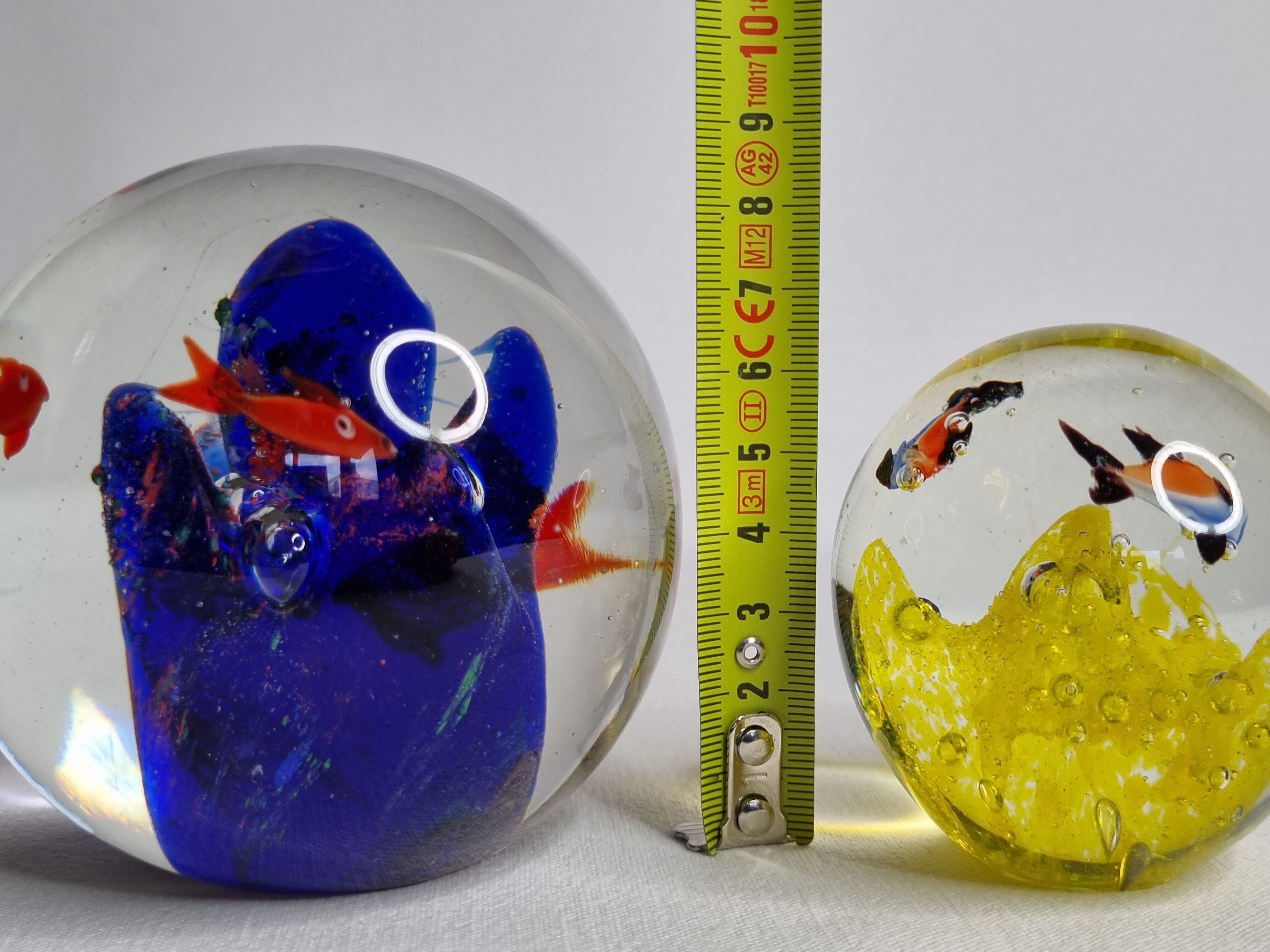 Set of two sulphides, glass paperweight with fish decorations