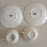 Two ivory cups and saucers from Sarreguemines