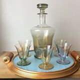 Aperitif liqueur service in iridescent glass on tray