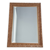 Mirror in gilded stucco wood and beveled glass