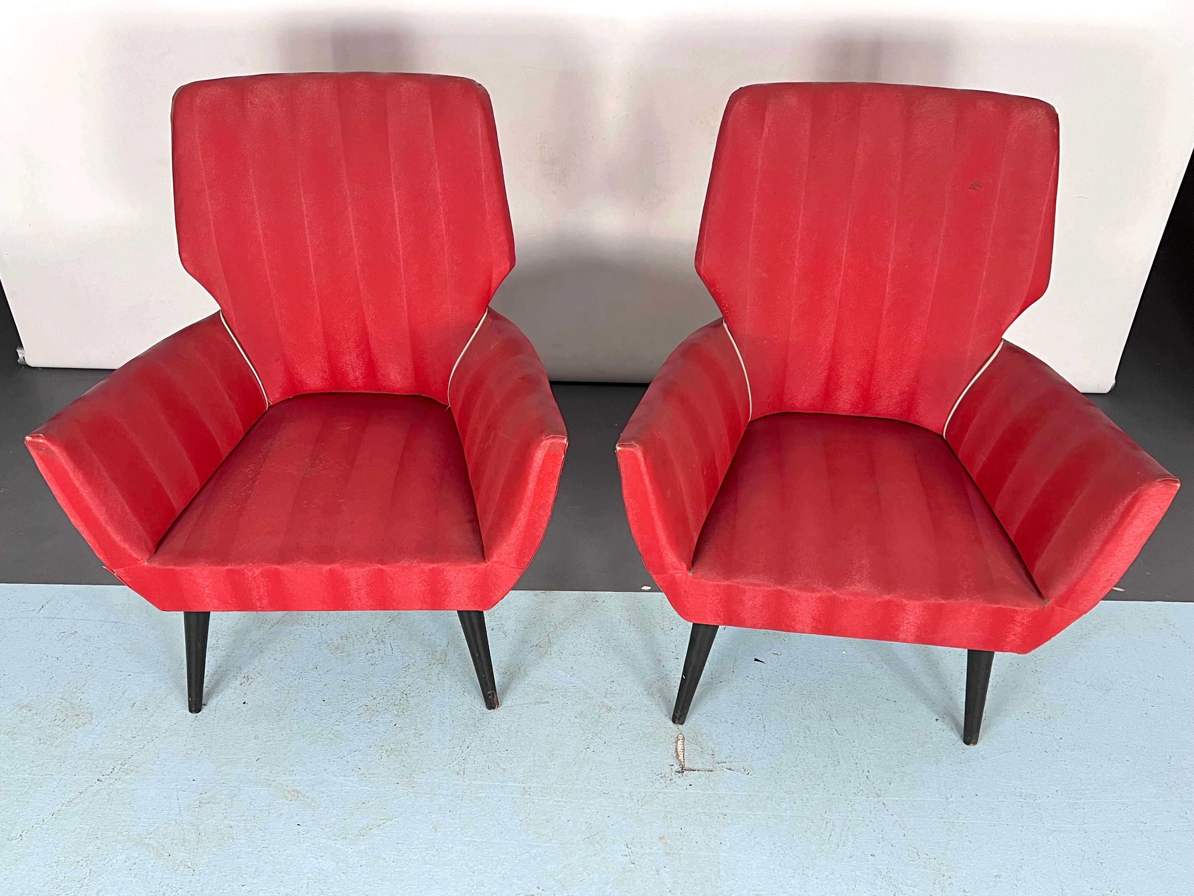 Mid-century modern pair of red armchairs. italy 1950s
