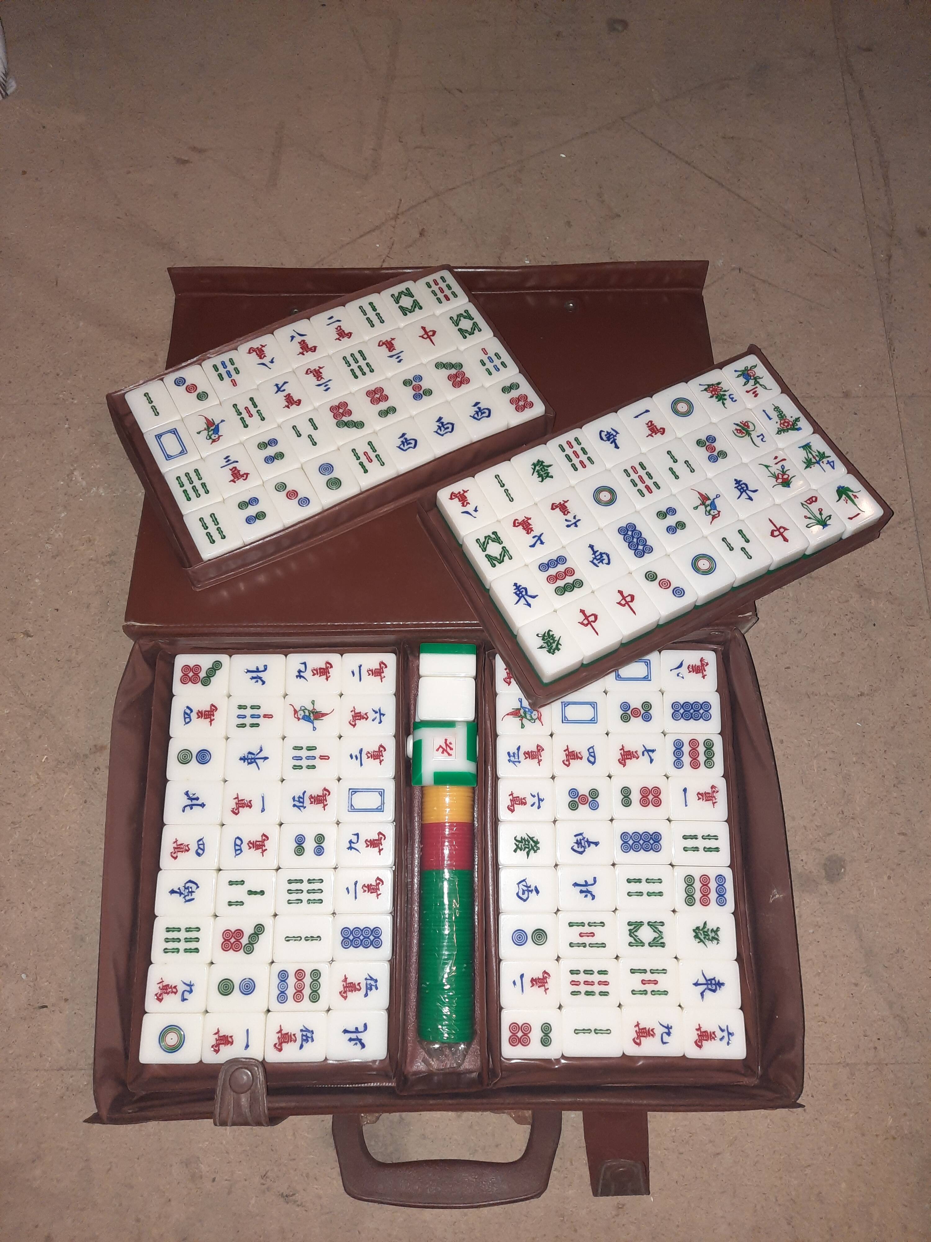 Complete vintage mahjong game with a faux leather case.