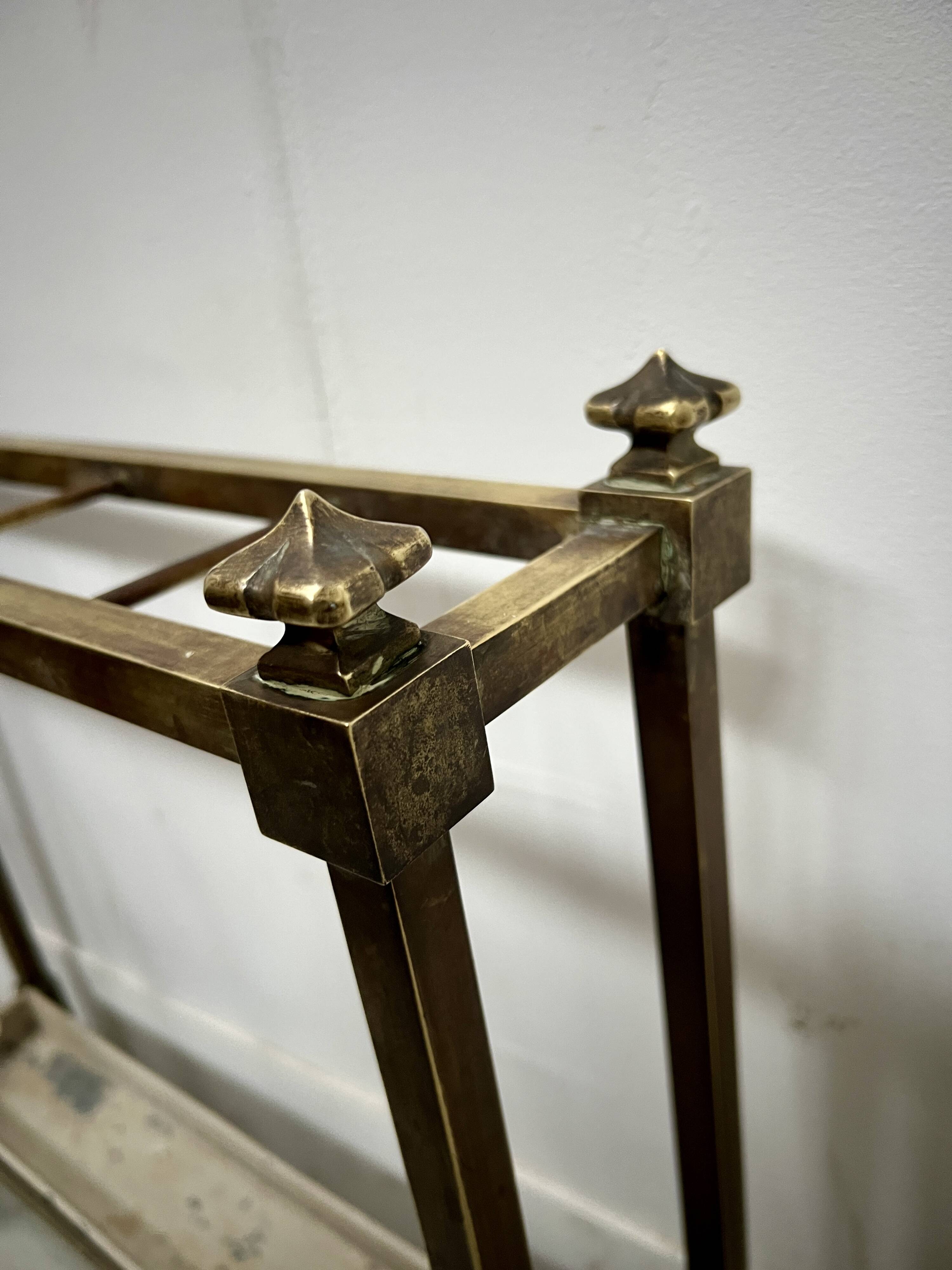 Brass and sheet metal umbrella stands from the 20th century.