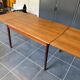 Extendable Scandinavian teak table by Johannes Andersen for Samcom Denmark.