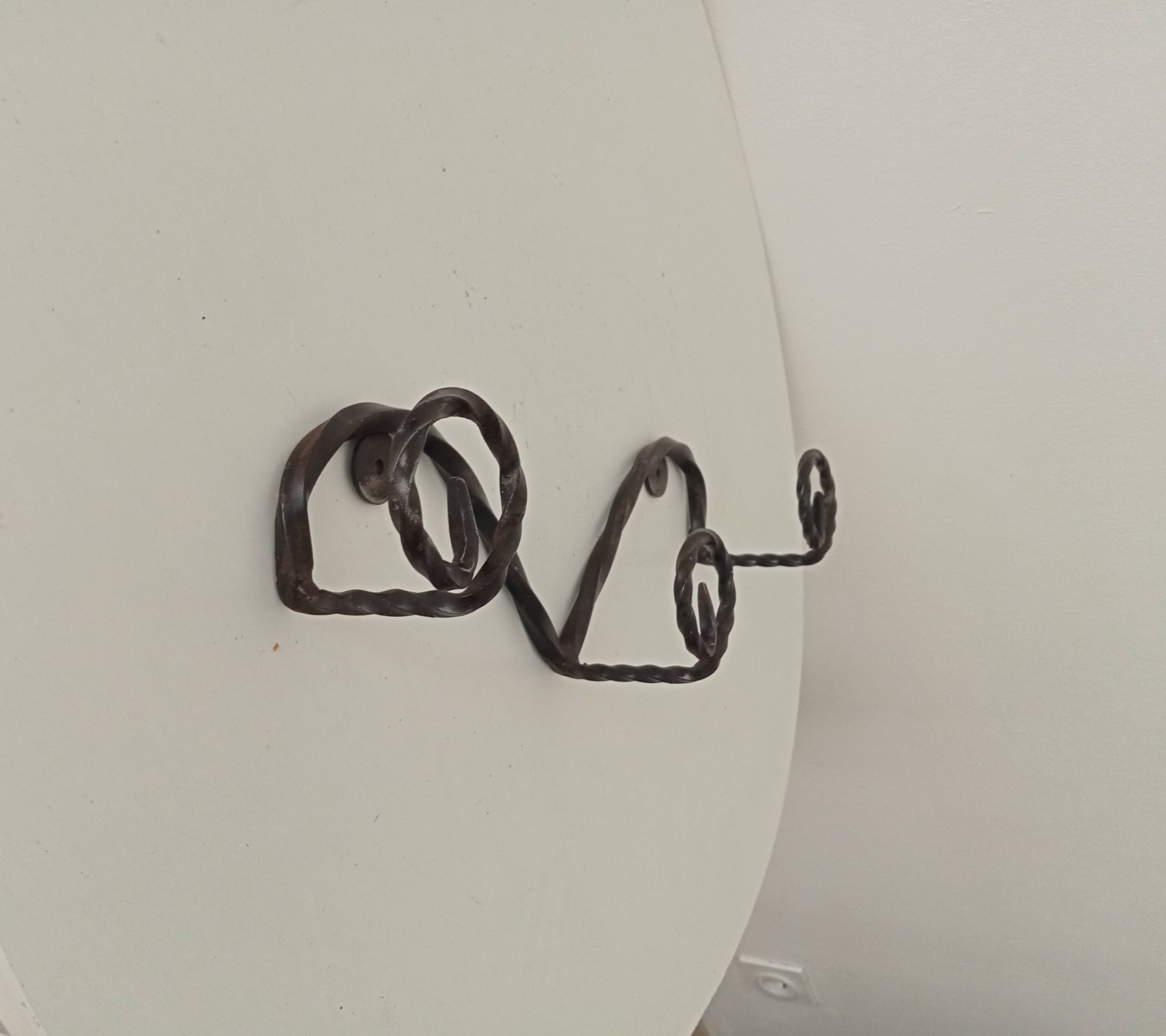 Vintage wrought iron wall coat rack