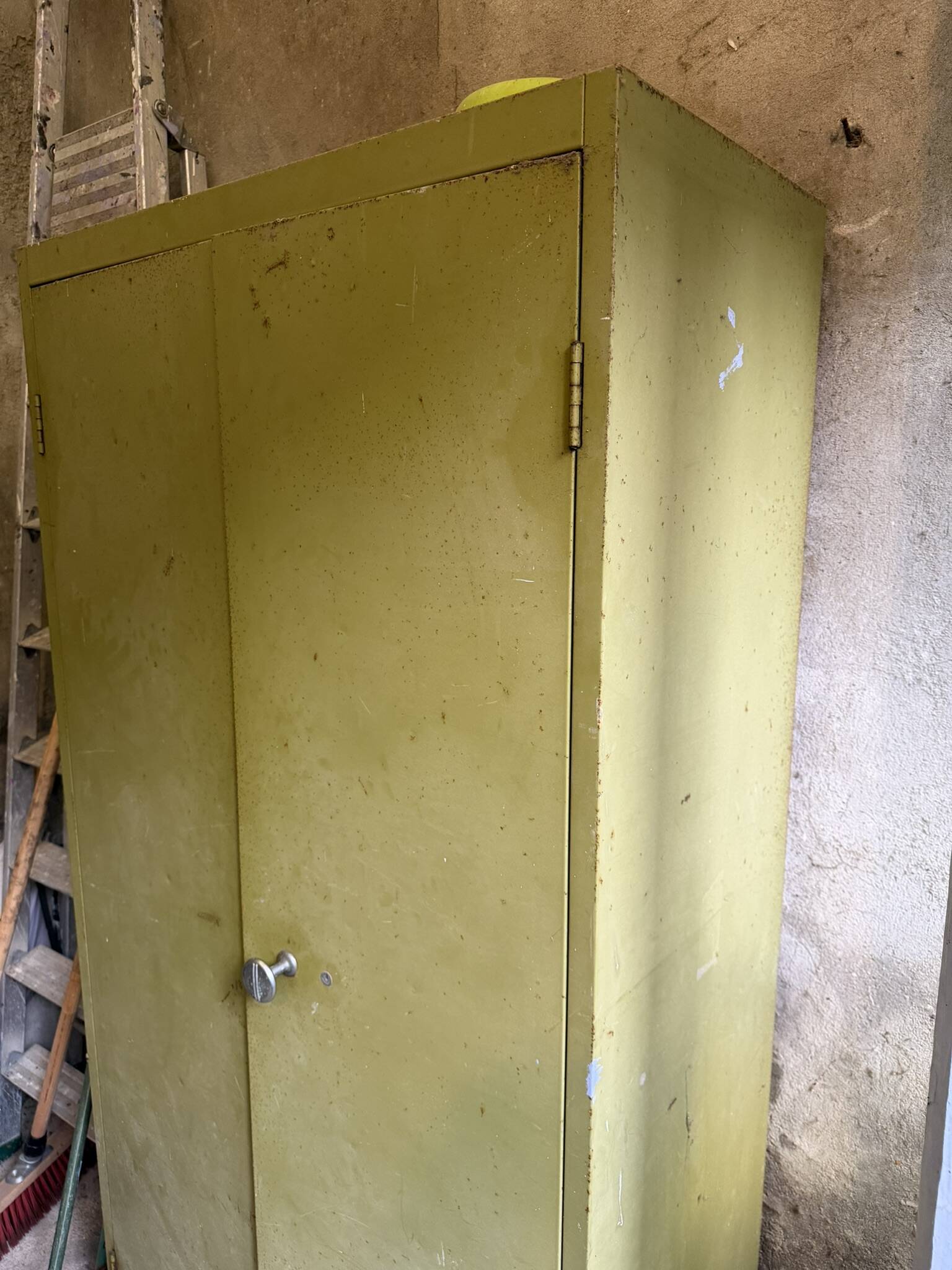 Green metal wardrobe in military style