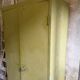 Green metal wardrobe in military style