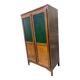 Vintage wooden display cabinet with green glass.