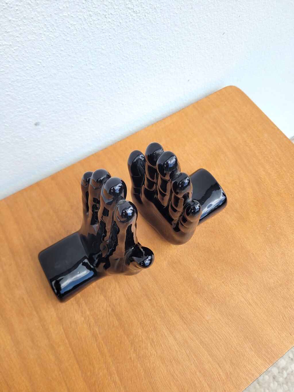 Pair of vintage black ceramic hand bookends
