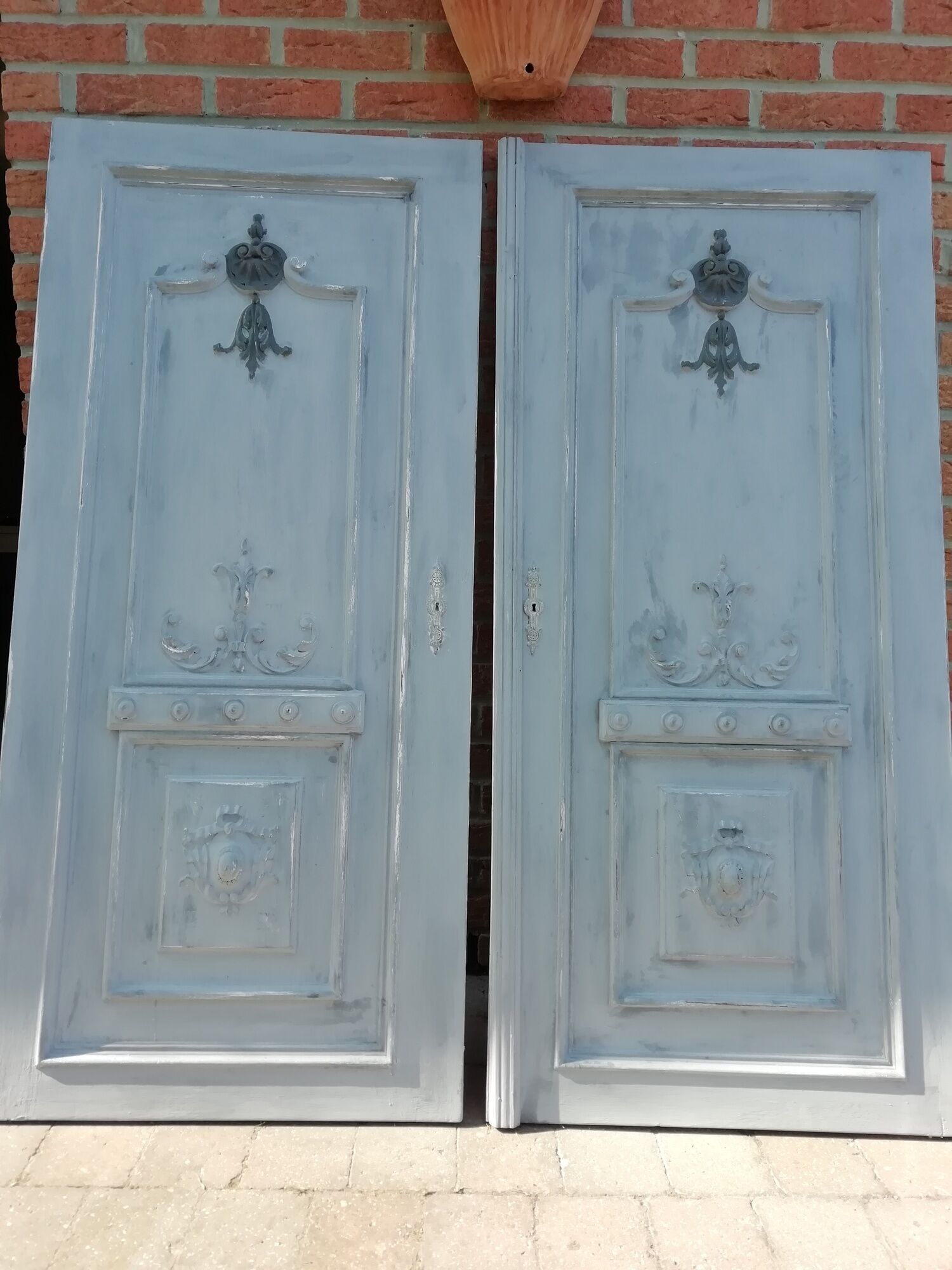 Pair of old door painted in carved wood