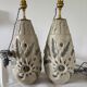 Pair of white glazed stoneware lamp bases, 20th-century floral decoration.