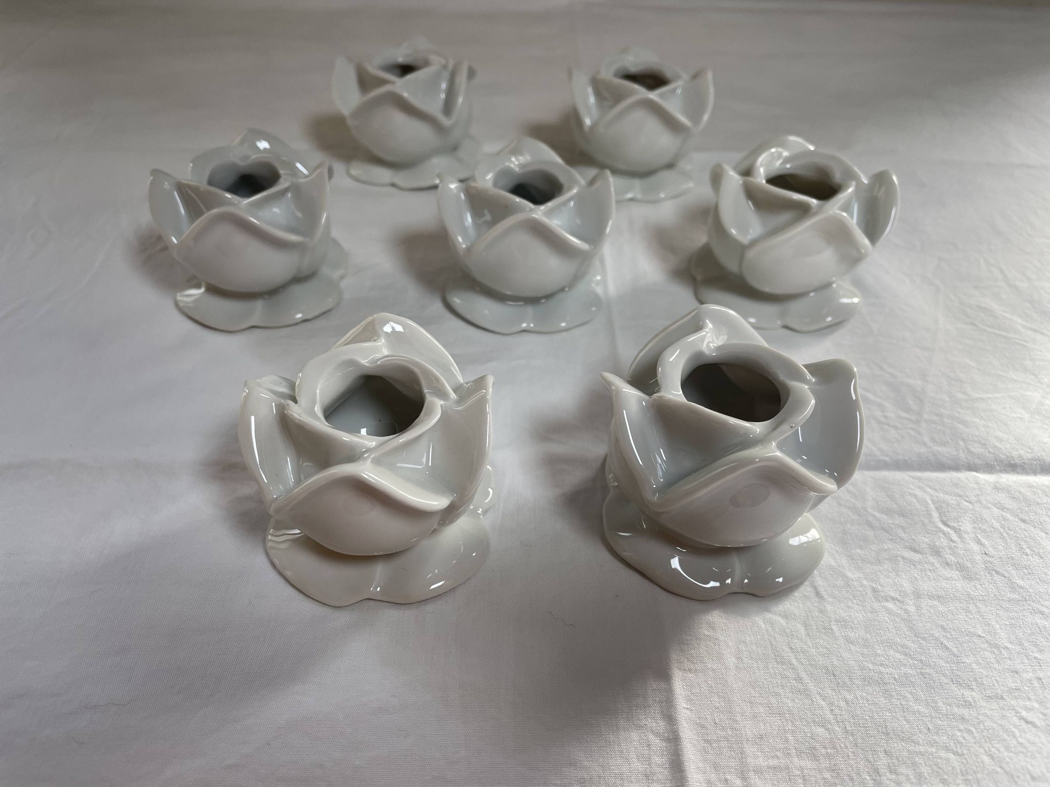 White porcelain rose shaped candle holders