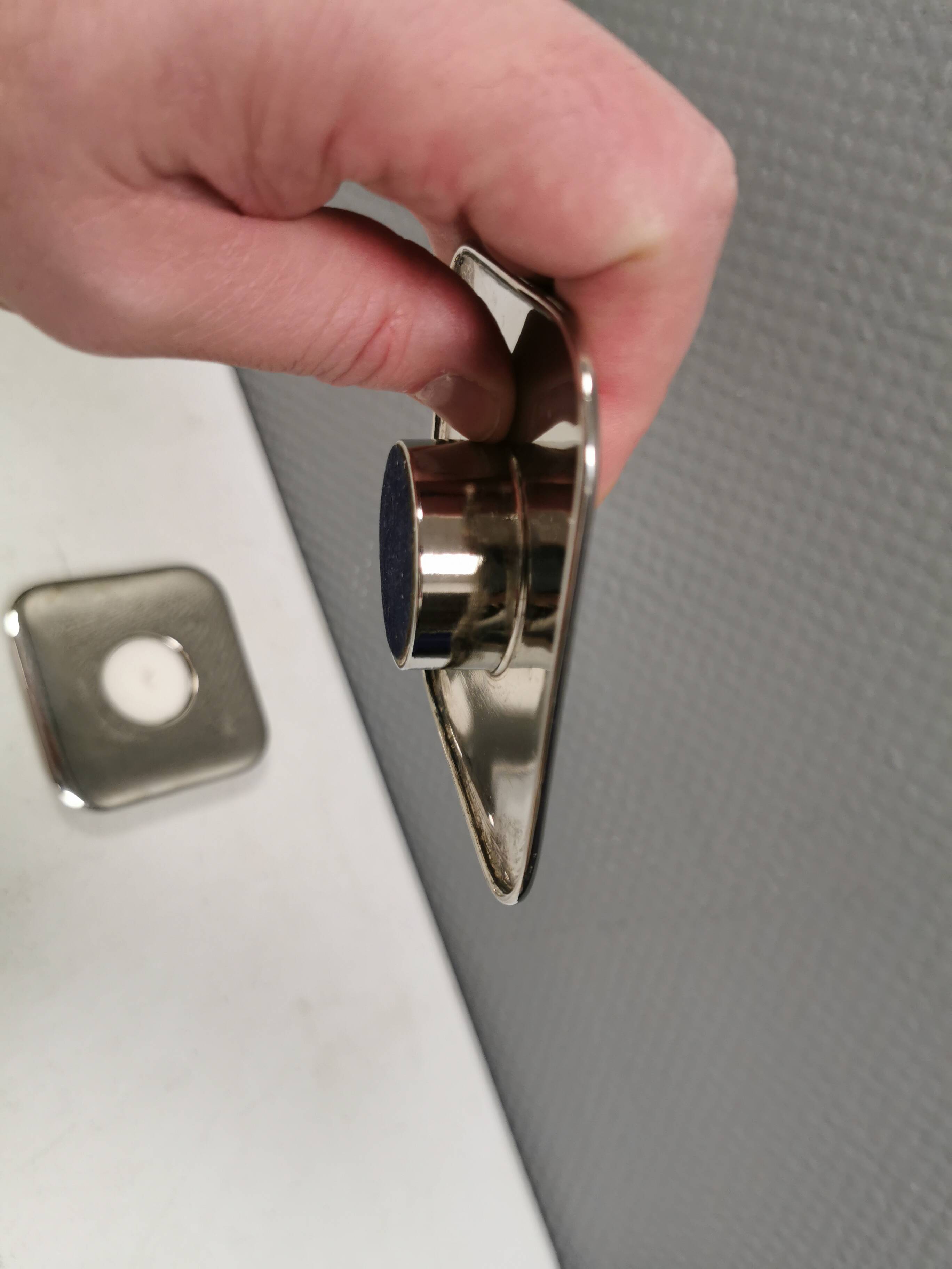 A set of classic Danish candlesticks in polished metal.