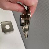 A set of classic Danish candlesticks in polished metal.