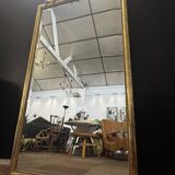 Large mirror with a gold frame