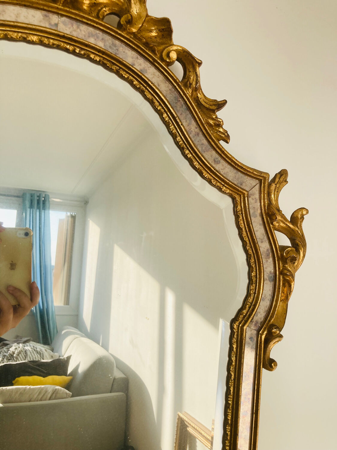 Large golden mirror parecloses