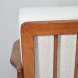 Canapé des années 60, en teck et bouclé blanc.