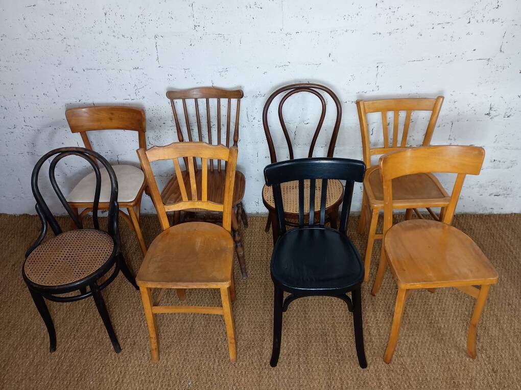 Set of 8 mismatched vintage Baumann Lebrun bistro chairs.