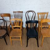 Set of 8 mismatched vintage Baumann Lebrun bistro chairs.